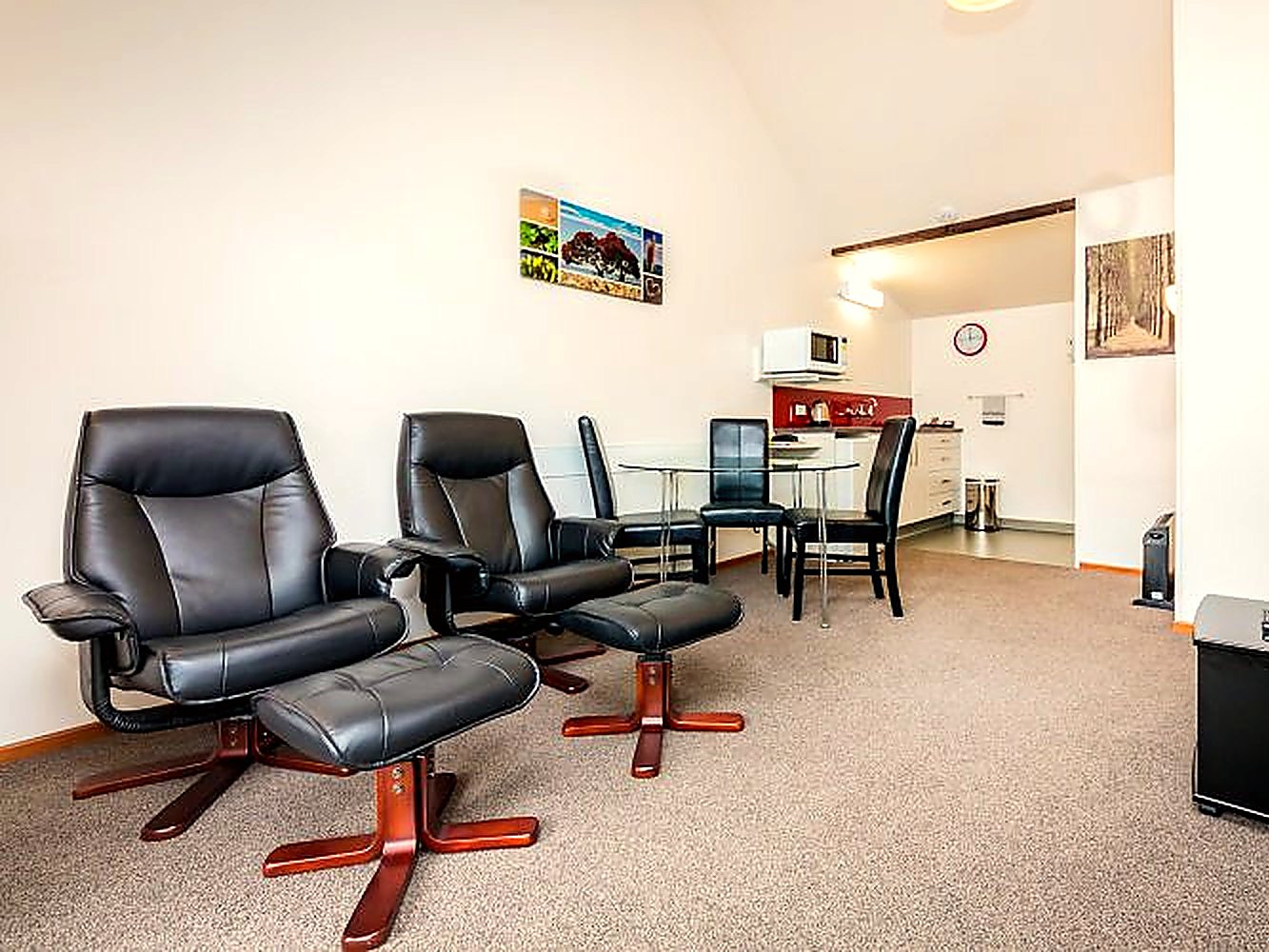 Two-bedroom apartment lounge with recliner chairs